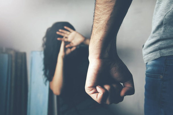 Man beating up his wife illustrating domestic violence - Φωτογραφία, εικόνα