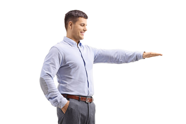 Man gesturing with hand and showing the height of something - Фото, зображення