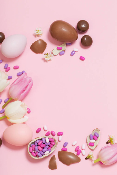 Easter pink background with eggs and flowers  - Photo, Image
