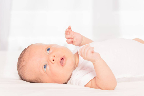 Newborn infant baby boy laying on the back - Foto, Imagen