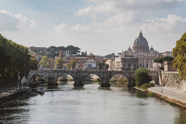 St. Peter's cathedral over bridge and Tiber river water at autumn day Rome - Foto, imagen