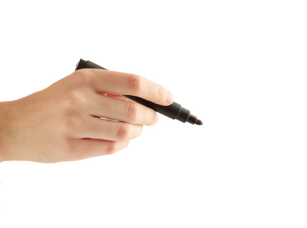 A hand holding a black marker on white background - Foto, Imagen