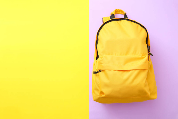 School backpack on color background - Фото, зображення