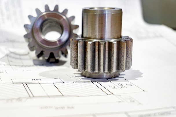 The gear after manufacturing on the gear cutter lies on the technical drawing. - Photo, Image