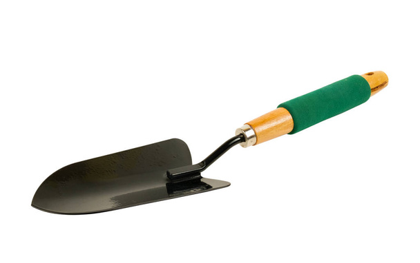 Черная лопата с зеленой ручкой
 - Фото, изображение