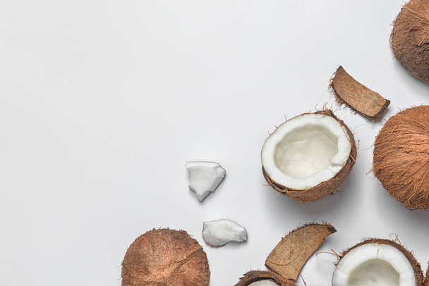 Ripe coconuts on white background - Фото, изображение