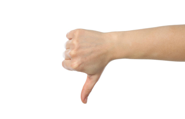 Kobiecy kciuk w dół, odizolowany na białym tle - Zdjęcie, obraz