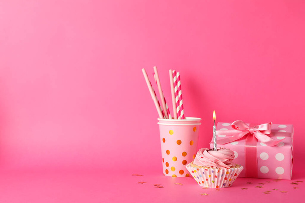 Composition with cupcake and gift box on pink background, space  - Photo, Image