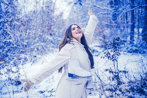 Enjoying nature wintertime. Vintage winter person. Girl playing with snow in park. Beautiful young woman laughing outdoors. - Foto, imagen