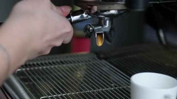 Full process of making coffee on professional coffee machine. Barista preparing double espresso, pouring it in white cup. - Footage, Video