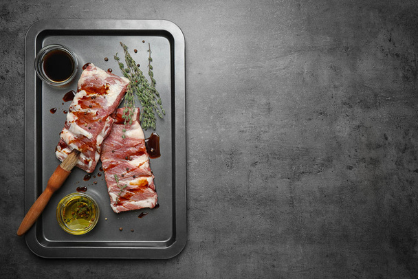Fresh raw ribs on grey table, top view. Space for text - Fotografie, Obrázek