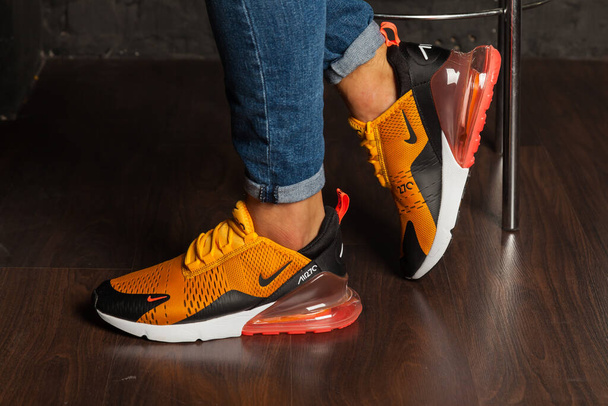 New beautiful colorful and nice Nike Air Max running shoes, sneakers, trainers shows the logo with a brand box on abstract background. Sport and casual footwear concept. Kyiv, Ukraine-August 26, 2018 - Foto, Imagen
