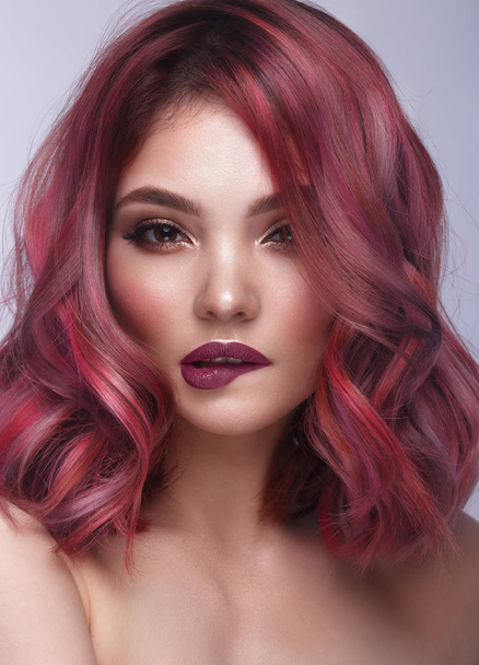 Beautiful girl with multi-colored hair and classic make-up and hairstyle. Beauty face. - Foto, Imagem