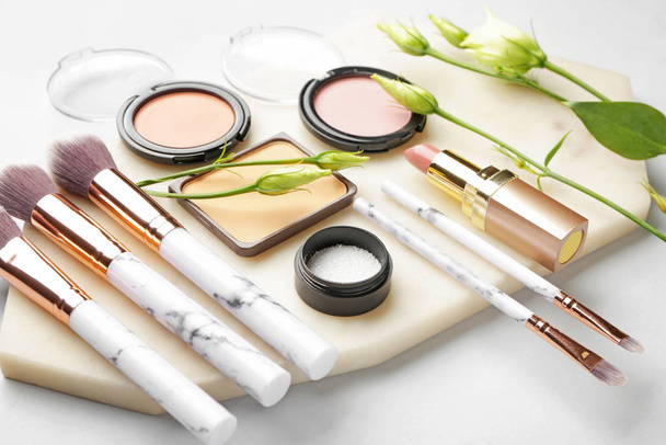 Set of decorative cosmetics on light background - Фото, изображение