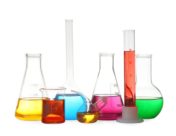 Different laboratory glassware with colorful liquids isolated on white - Fotografie, Obrázek