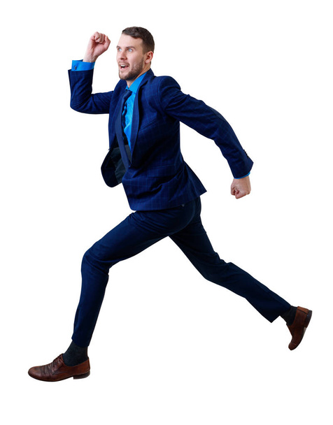 Young businessman in blue suit running fast. - Foto, Imagen