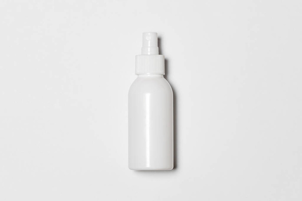Cosmetic Or Hygiene Spray Dispenser Pump Plastic Bottle on white background.Top view.High-resolution photo. - Foto, Imagen