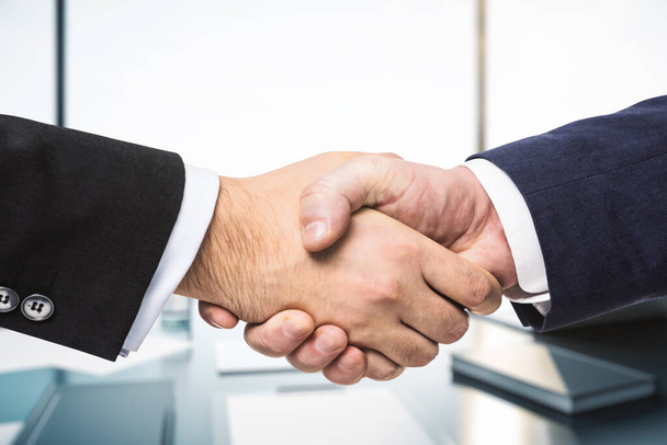 Two businessmen shake hands, partnership concept, closeup - Zdjęcie, obraz