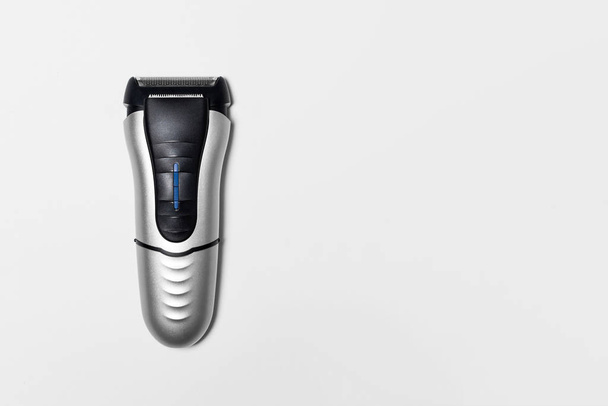 Modern battery Electric Shaver for man isolated on white background with clipping path.High-resolution photo.Top view.Close-up. - Valokuva, kuva
