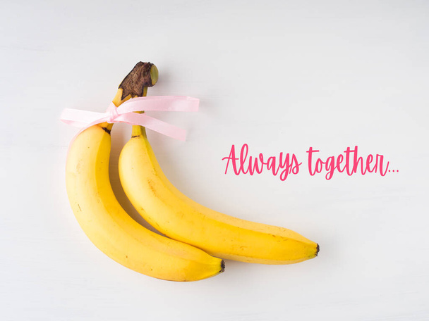 Two bananas. Happy valentines day concept text - Valokuva, kuva