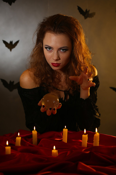 Halloween witch on dark background - Foto, imagen