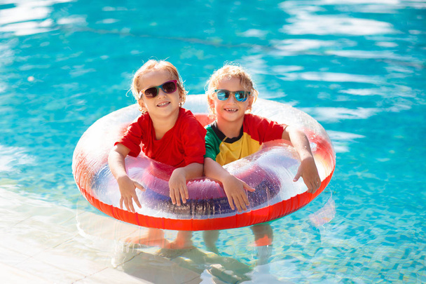 Kids in swimming pool. Life jacket for child. - Fotoğraf, Görsel