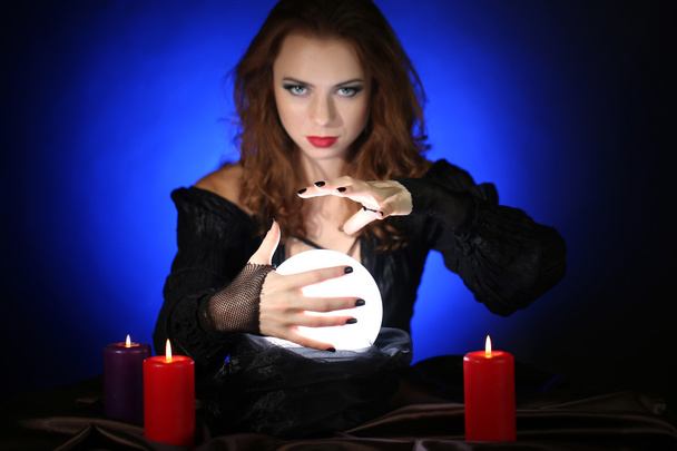 Halloween witch on dark blue background - Фото, изображение
