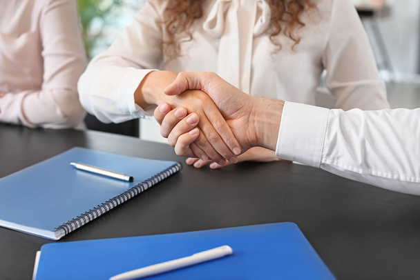 Human resources manager shaking hands with applicant after successful interview - Foto, Bild