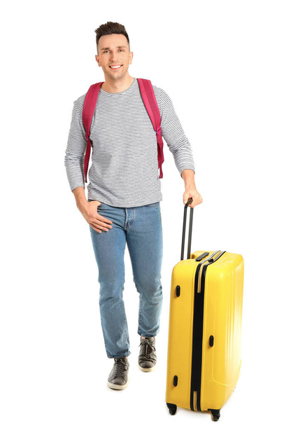 Male tourist with luggage on white background - Photo, Image