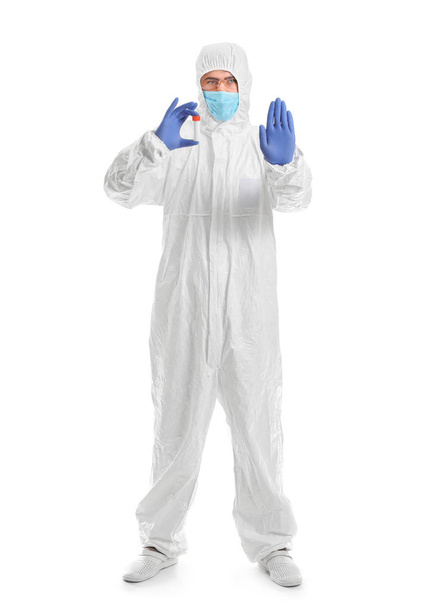 Laboratory worker in protective uniform holding test tube with sample on white background. Concept of epidemic - Zdjęcie, obraz