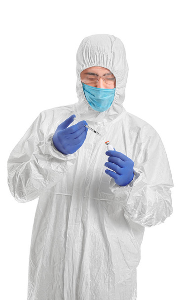 Laboratory worker in protective uniform and with remedy on white background. Concept of epidemic - Fotografie, Obrázek