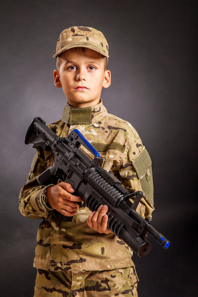 Young soldier with rifle - Φωτογραφία, εικόνα