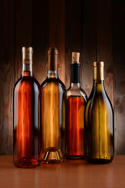 Wine Bottles Against Wood Background - Zdjęcie, obraz