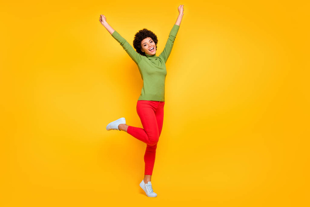 Full length body size view of her she nice attractive lovely teenage cheerful wavy-haired girl celebrating having fun free time isolated over bright vivid shine vibrant yellow color background - Fotografie, Obrázek