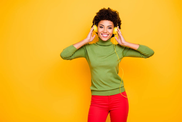 Portrait of her she nice attractive lovely pretty cheerful cheery brown wavy-haired girl listening cool music soul funk isolated over bright vivid shine vibrant yellow color background - 写真・画像