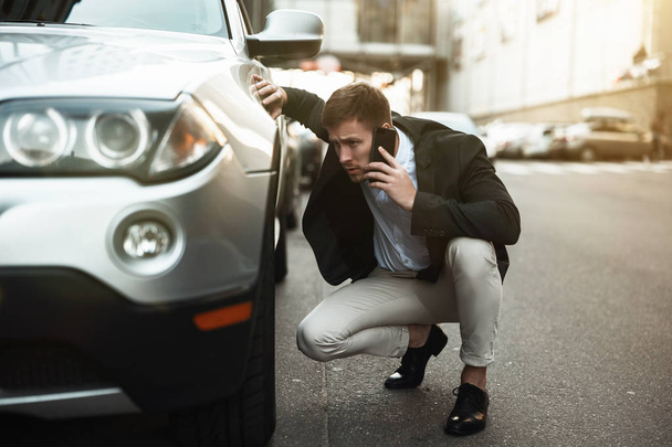 young handsome businessman looks nervous just had car crush in the middle of the road calling to service station assistance , unexpectable vehicle trouble - Φωτογραφία, εικόνα