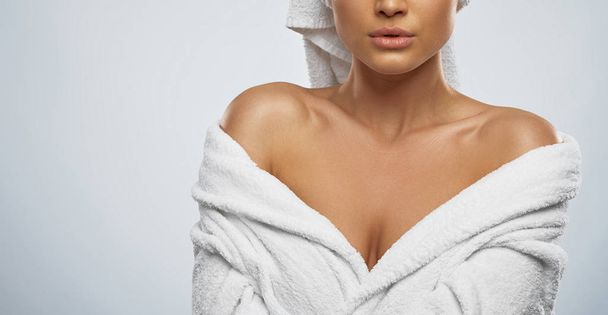 Woman in bathrobe and towel posing. - Fotografie, Obrázek