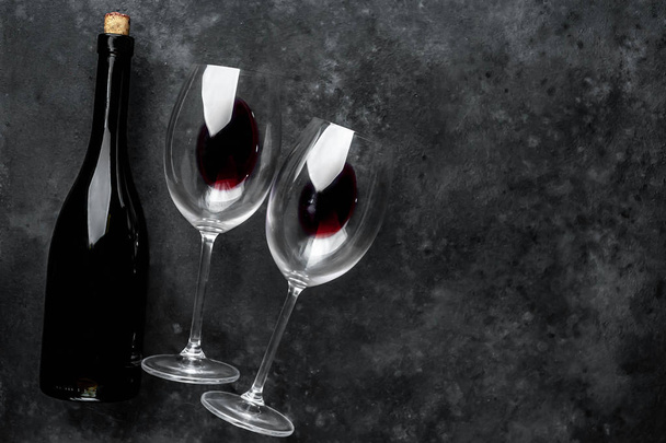 Red wine glasses on the background stone - Photo, Image
