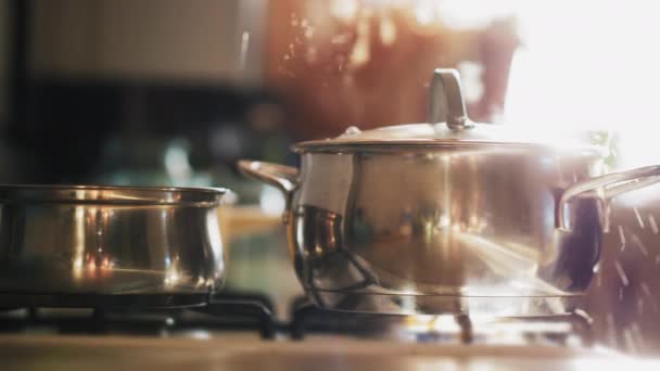 A cooking pot with boiled water on a gas stove - Footage, Video