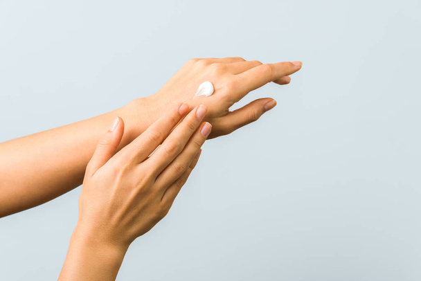 skincare. close up view of woman hand moisturising them with cream. skincare - Zdjęcie, obraz