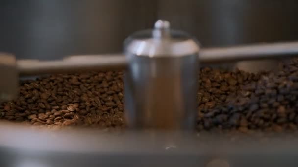 Coffee roasting process in small roaster factory - Кадри, відео