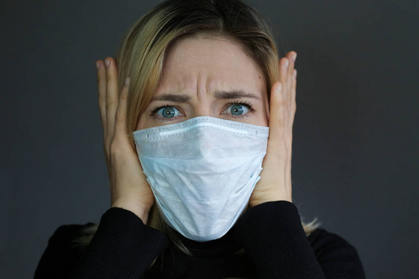 Sick woman feeling bad. Woman wear protective medical mask. Self protection. - Photo, Image