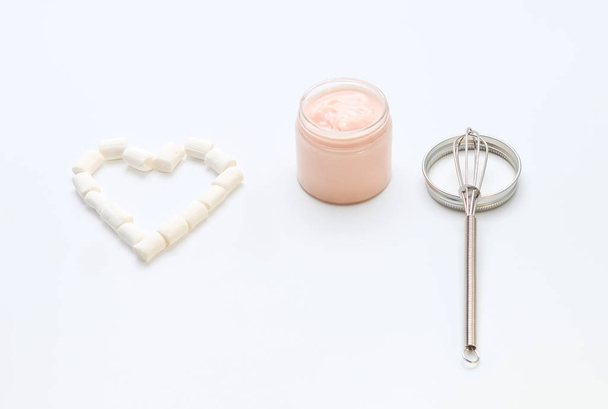 a handmade cream in a jar with a heart - Fotoğraf, Görsel
