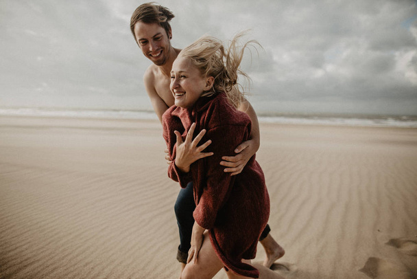 happy couple in love spend good time on the beach and enjoy each other - 写真・画像