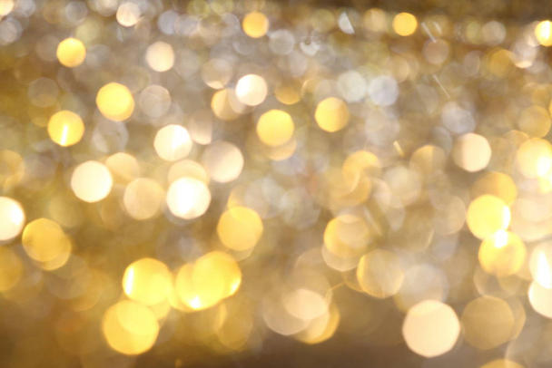 abstrakte goldene Bokeh Hintergrund mit leuchtenden Defokus funkelt - Foto, Bild