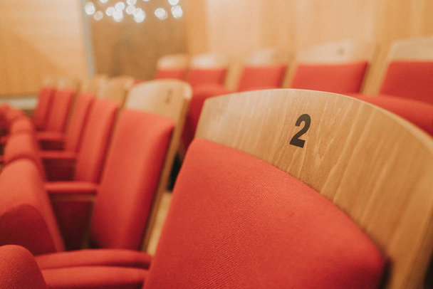 Selective focus shots of woods seats in the theater - 写真・画像