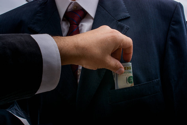 Koncepce korupce a úplatkářství financování podvodů s balíčkem dolarů - Fotografie, Obrázek