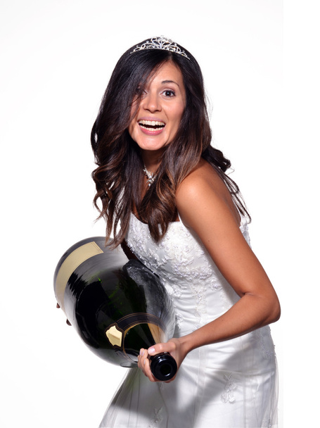 Happy bride holding a big champagne bottle - Foto, afbeelding