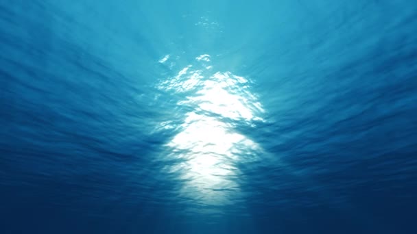 Suyun altında ışık, okyanus yüzeyinde parlayan güneş ışığı. - Video, Çekim