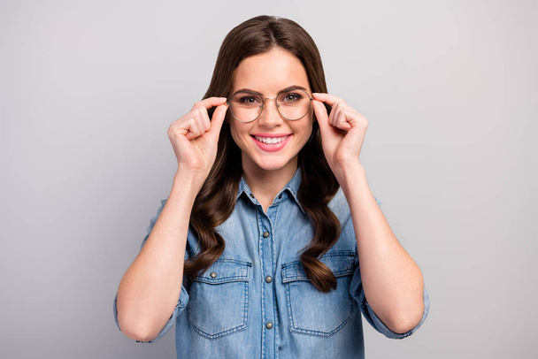 Closeup photo of beautiful pretty business lady use new eyewear for work with computer save protect eyesight wear specs casual jeans shirt isolated grey color background - Foto, Imagen